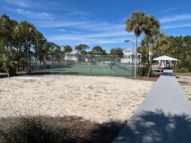 view of home's community with tennis court and a gazebo