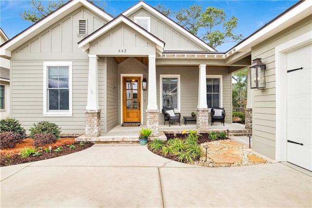 443 Colony Dr, Fairhope, AL 36532 - view of front facade with a garage, covered porch, and board and batten siding