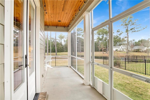 sunroom with wood ceiling