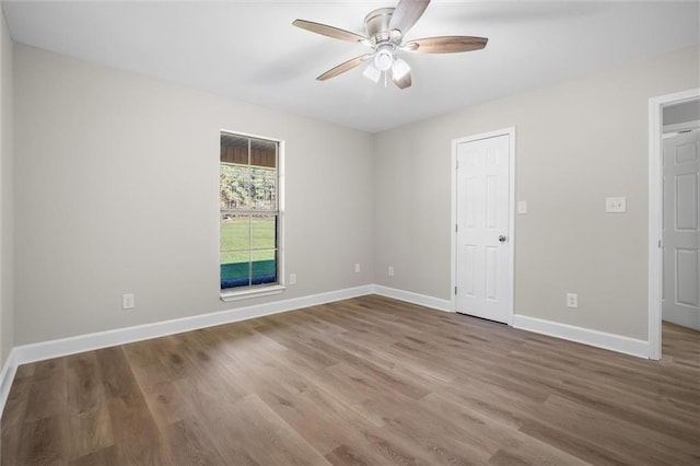 spare room with ceiling fan and hardwood / wood-style flooring