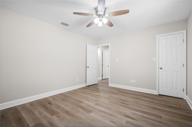 unfurnished bedroom with wood-type flooring and ceiling fan