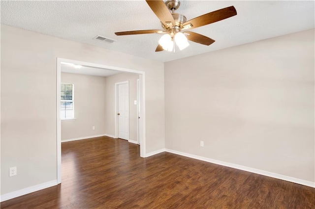 unfurnished room featuring ceiling fan, dark hardwood / wood-style floors, and a textured ceiling