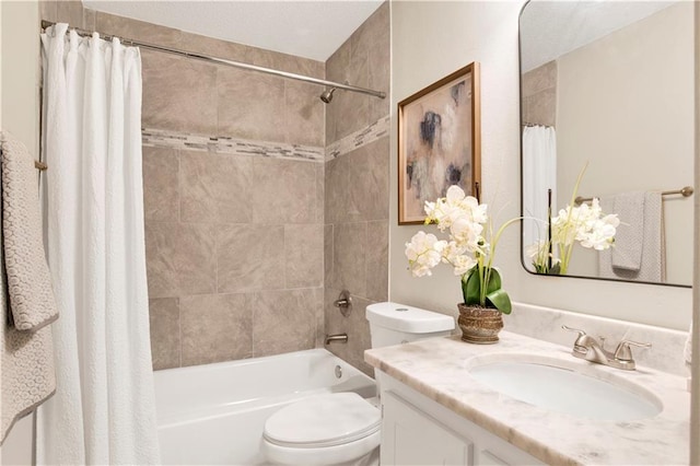 full bathroom featuring vanity, shower / bath combo with shower curtain, and toilet