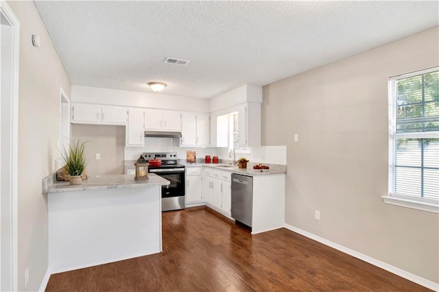 kitchen with sink, a textured ceiling, dark hardwood / wood-style flooring, stainless steel appliances, and white cabinets