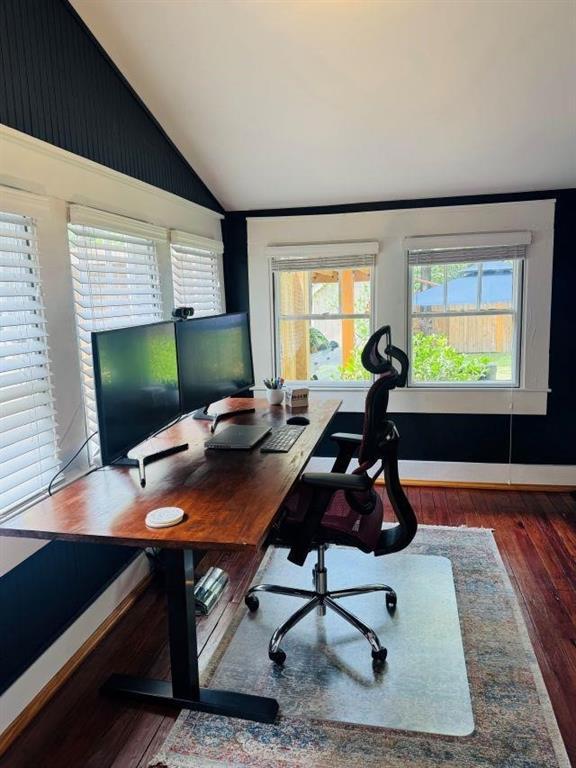 office area with lofted ceiling and wood finished floors