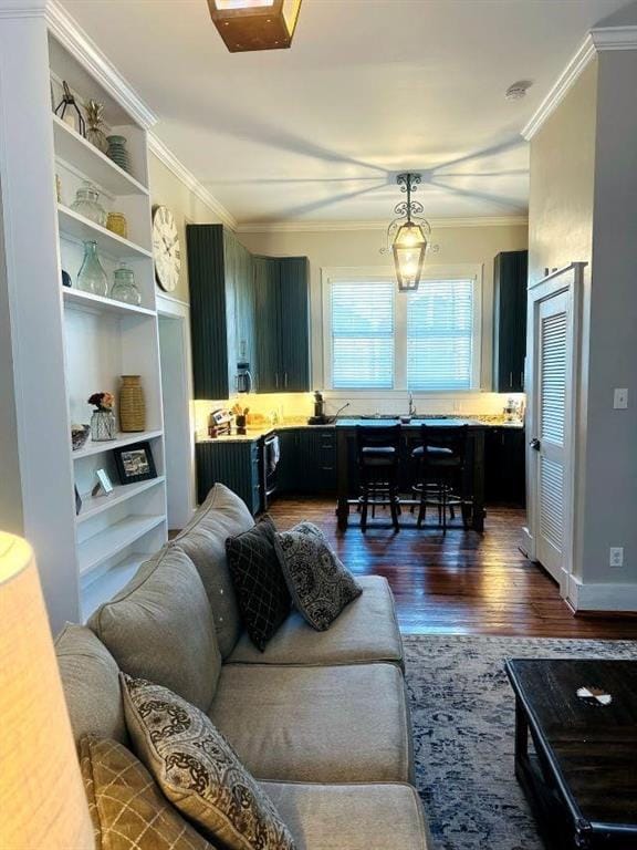 living room with ornamental molding and dark wood finished floors