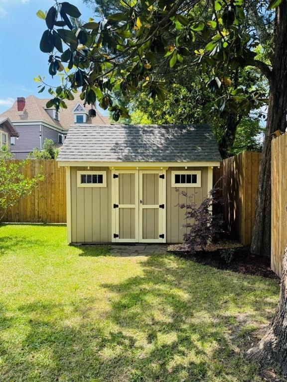 view of shed with a fenced backyard