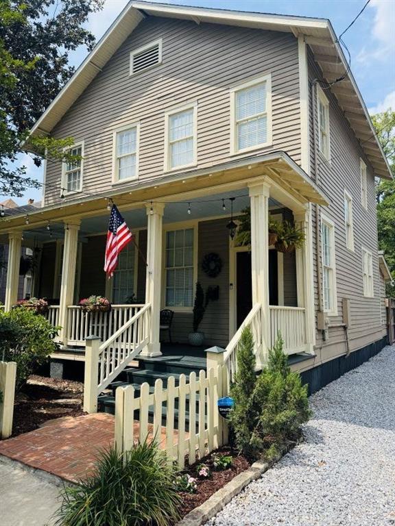 country-style home with covered porch
