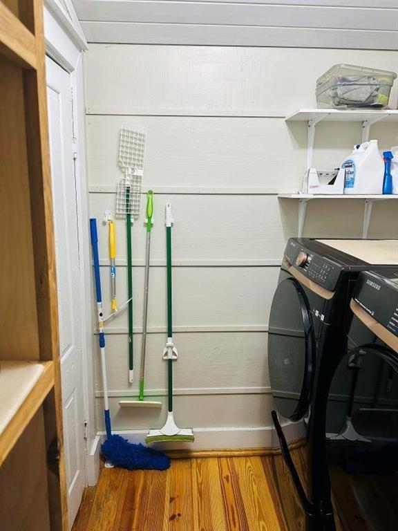 washroom with laundry area and wood finished floors