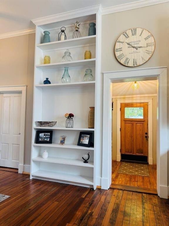 details featuring built in shelves, ornamental molding, and wood finished floors