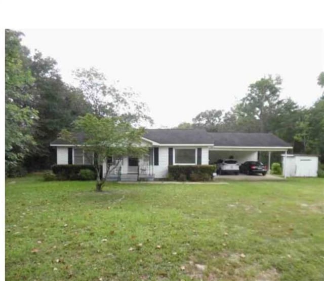 single story home with a carport and a front lawn