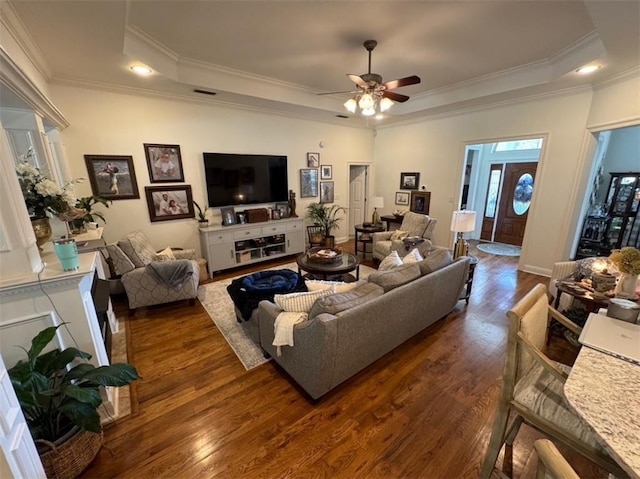5541 Riverwood Lndg, Theodore, AL 36582 - living room featuring a tray ceiling, dark wood-style flooring, a ceiling fan, crown molding, and recessed lighting