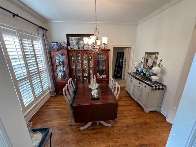 5541 Riverwood Lndg, Theodore, AL 36582 - dining space with a chandelier, crown molding, and wood finished floors