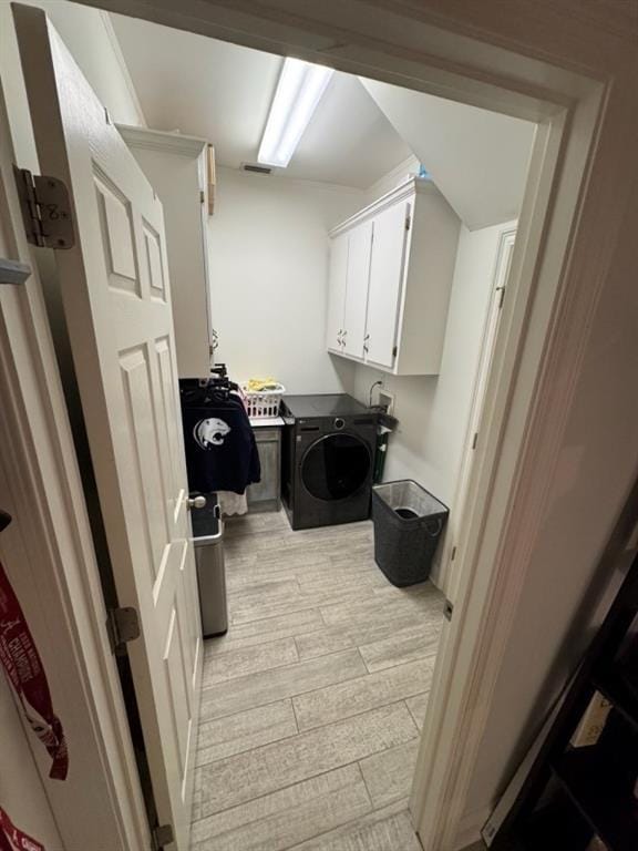5541 Riverwood Lndg, Theodore, AL 36582 - washroom featuring light wood-style flooring, independent washer and dryer, and cabinet space
