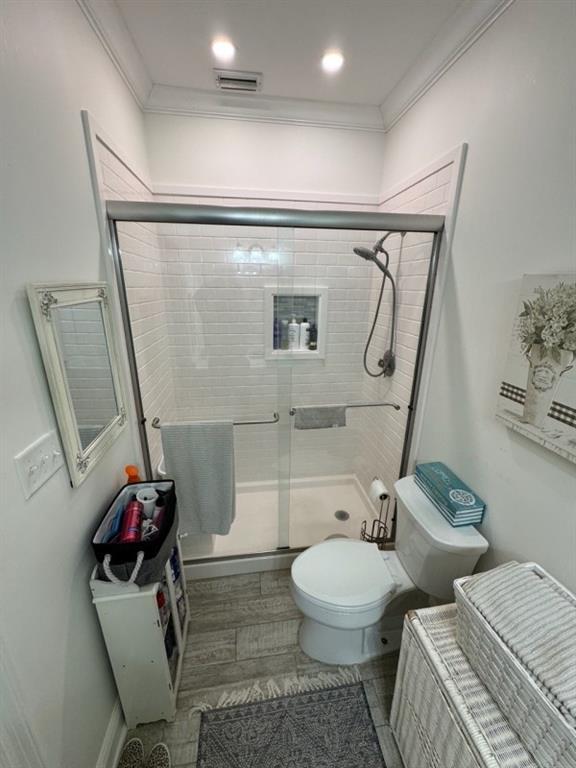 5541 Riverwood Lndg, Theodore, AL 36582 - bathroom featuring a stall shower and ornamental molding