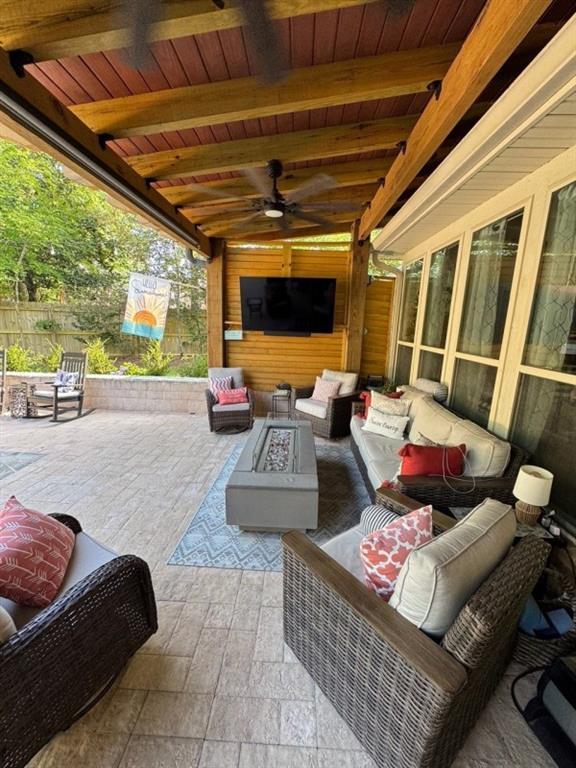 5541 Riverwood Lndg, Theodore, AL 36582 - view of patio with an outdoor living space with a fire pit and a ceiling fan