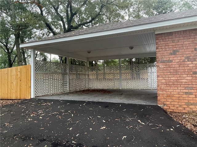 view of parking / parking lot featuring a carport