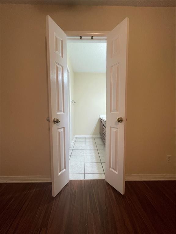 hallway with wood-type flooring