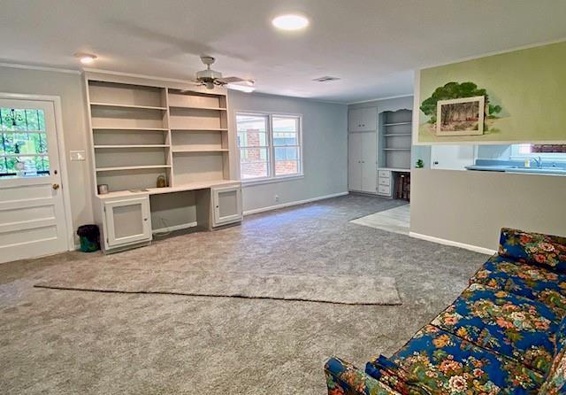 1313 Innsbruck Dr, Mobile, AL 36608 - unfurnished living room with carpet floors, a ceiling fan, and baseboards