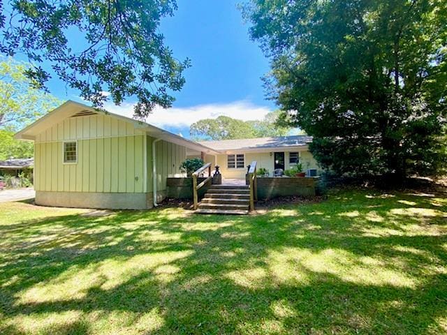 1313 Innsbruck Dr, Mobile, AL 36608 - rear view of property featuring board and batten siding, a yard, and a deck