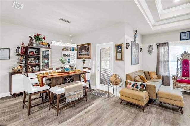 dining room with wood-type flooring