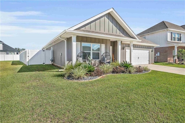 view of front of home with a garage and a front lawn