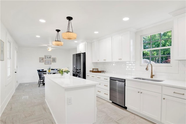 kitchen featuring a sink, stainless steel dishwasher, backsplash, recessed lighting, and a center island
