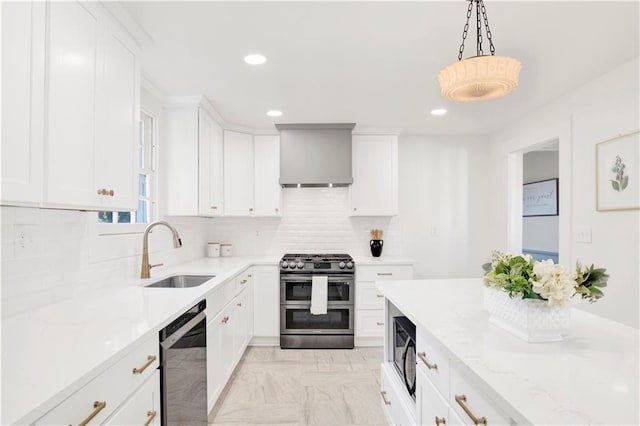 kitchen featuring double oven range, a sink, dishwashing machine, custom exhaust hood, and recessed lighting