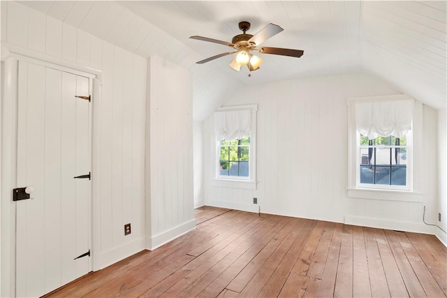bonus room with hardwood / wood-style flooring, vaulted ceiling, and a ceiling fan