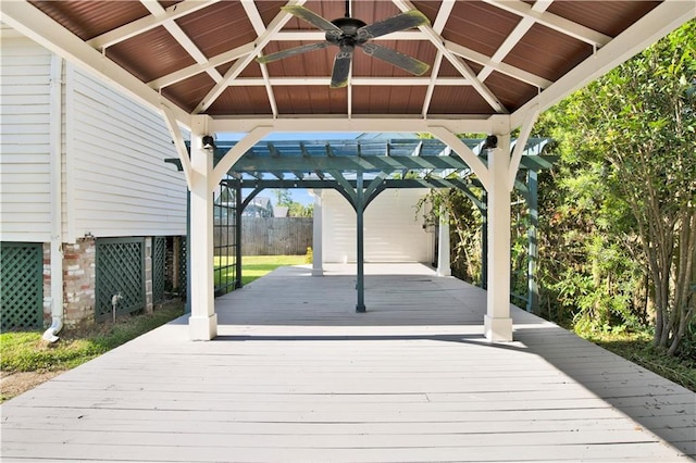 deck featuring a gazebo, ceiling fan, and fence
