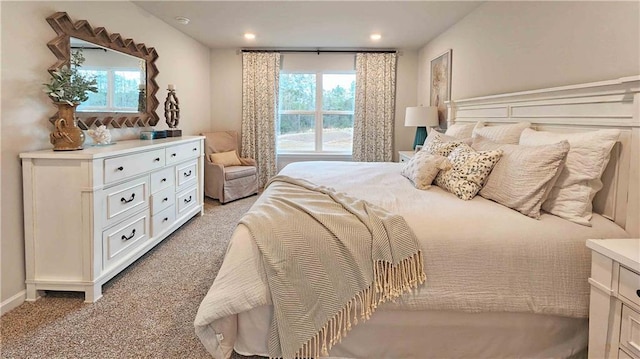 bedroom with light carpet and recessed lighting