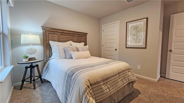 bedroom with carpet and baseboards