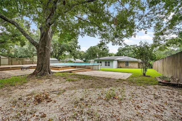 5175 Somerset Dr W, Mobile, AL 36619 - view of yard with an outdoor pool and a deck