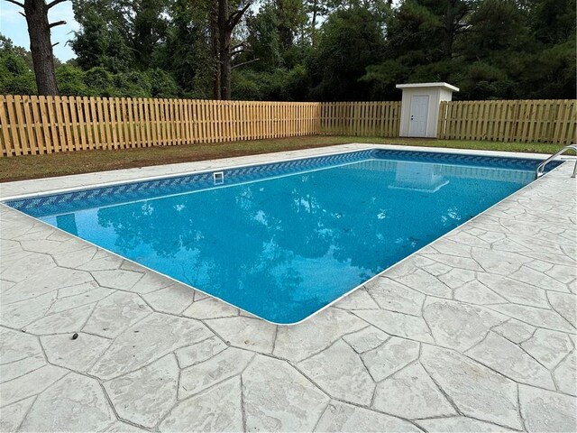 view of swimming pool with a patio