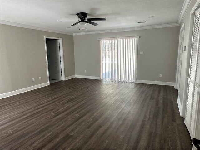 interior space with dark hardwood / wood-style floors, ceiling fan, and ornamental molding