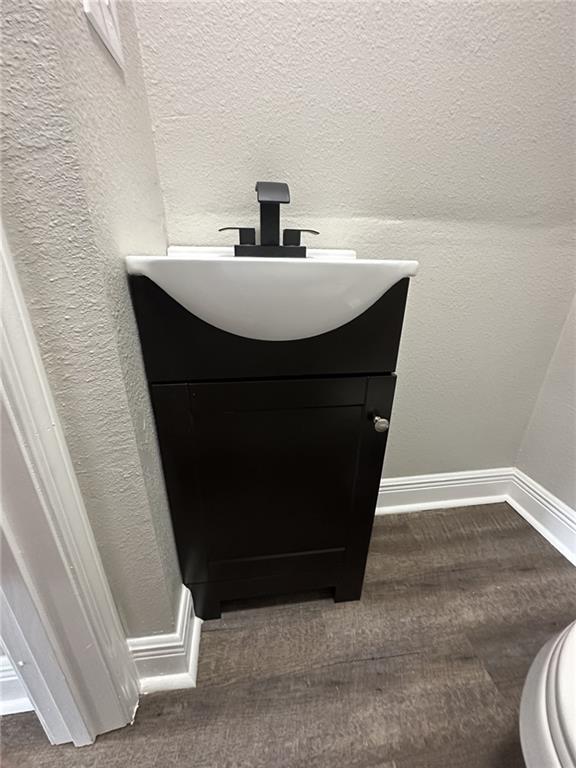 bathroom with toilet and vanity