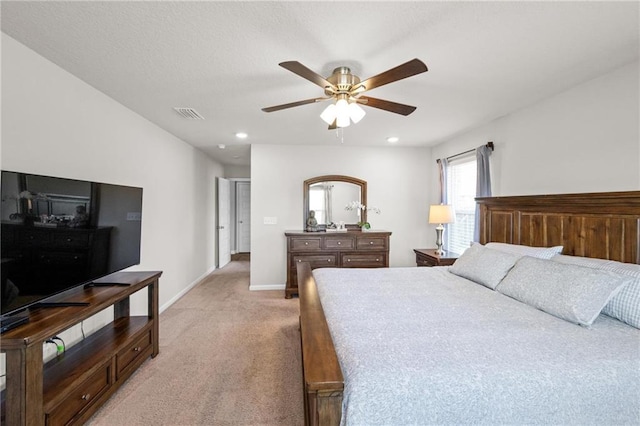 bedroom with light carpet and ceiling fan