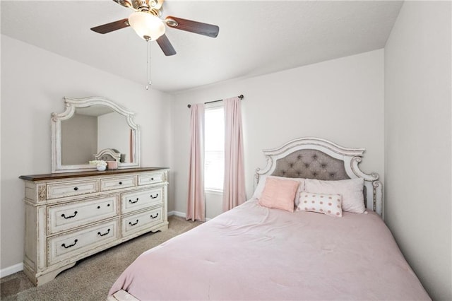 bedroom featuring ceiling fan and light colored carpet