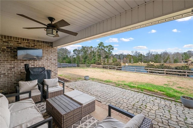 view of patio / terrace featuring an outdoor living space and ceiling fan