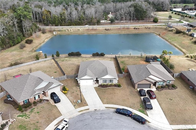 birds eye view of property featuring a water view