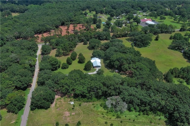 drone / aerial view featuring a forest view