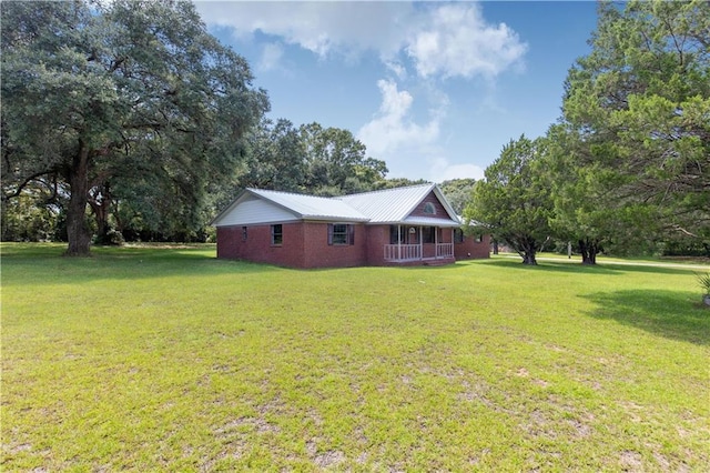 view of yard with covered porch