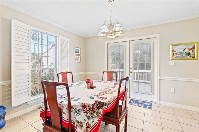 dining room with crown molding, light tile patterned flooring, and a chandelier