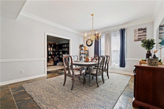 dining area featuring ornamental molding, dark tile floors, and an inviting chandelier