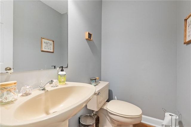 bathroom with sink and toilet