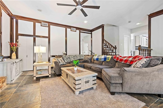 living room featuring ceiling fan and tile floors