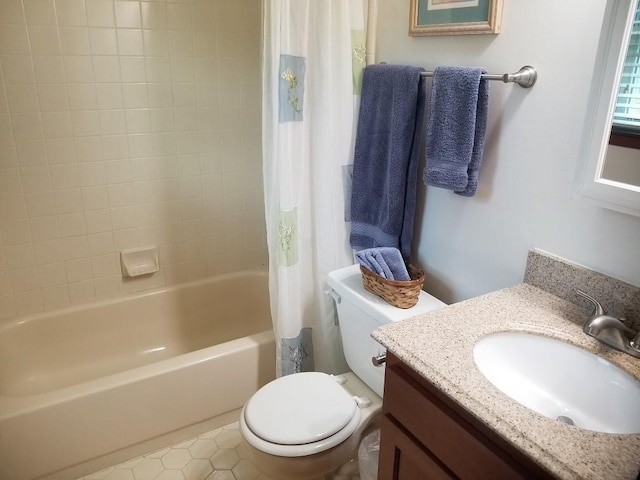 full bathroom featuring tile patterned floors, vanity, shower / tub combo, and toilet