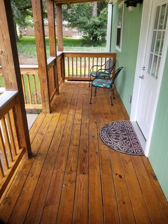 wooden terrace with a porch