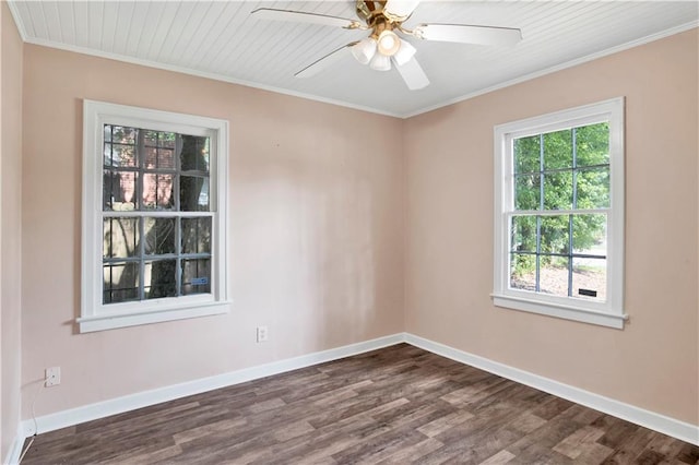 empty room featuring ceiling fan, dark wood-type flooring, and ornamental molding