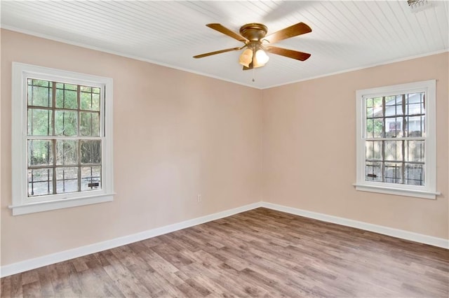 unfurnished room with ceiling fan, hardwood / wood-style floors, and ornamental molding